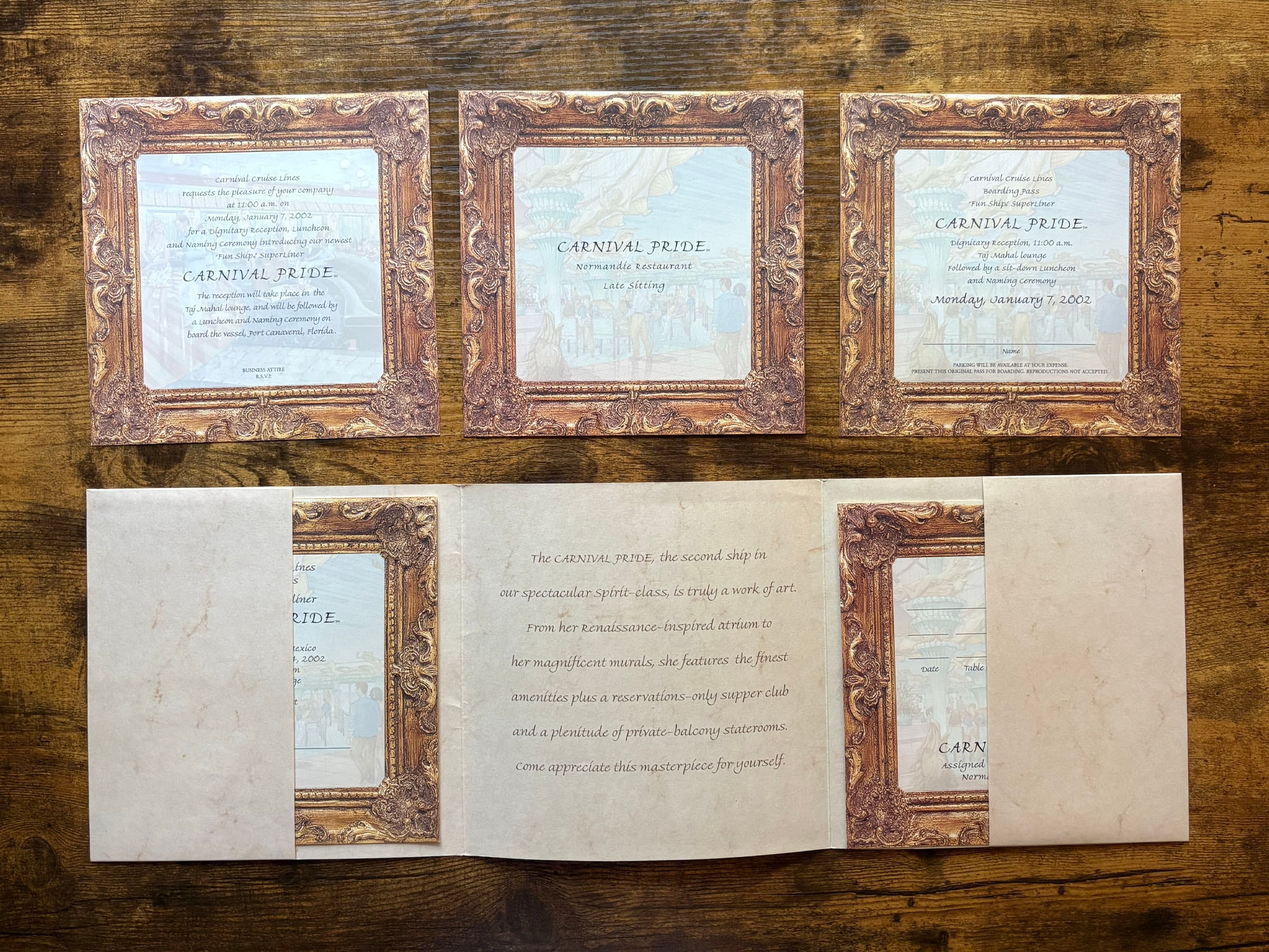 All Carnival Pride invitation pieces laid out on wooden surface