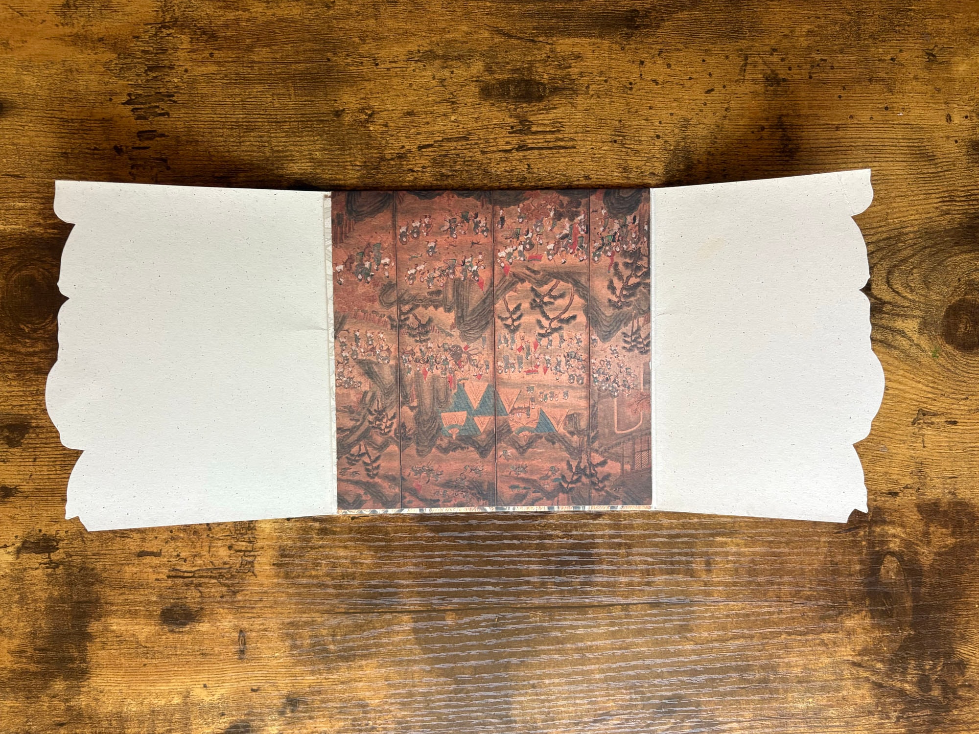 Carnival Spirit invitation open showing ornate Asian-inspired lacquered panel artwork